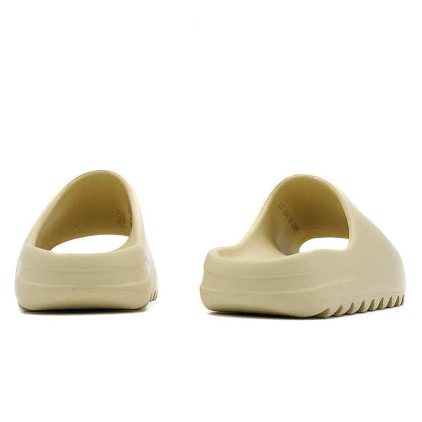 Kanye West wore Yeezy slides that looked too small to a.