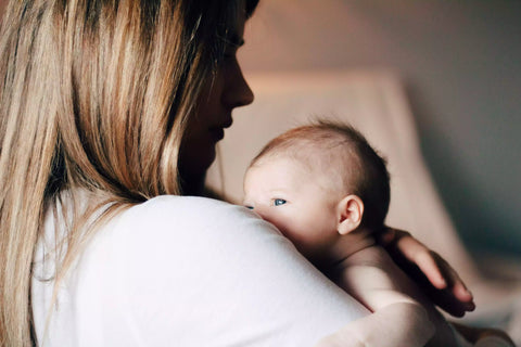 Mother holding baby in her arms