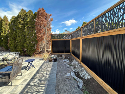 Corrugated Metal Fencing In A Backyard