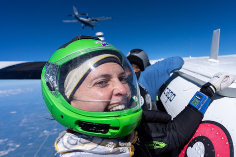 Laura smiling wearing her canula outside the plane