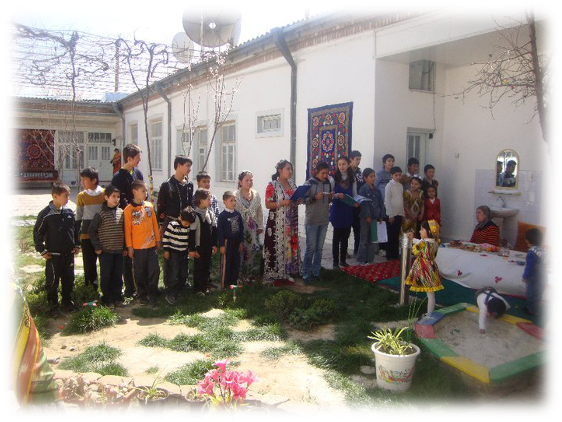 Tajik family gathered to make sumalak in Tajikistan at Navruz.