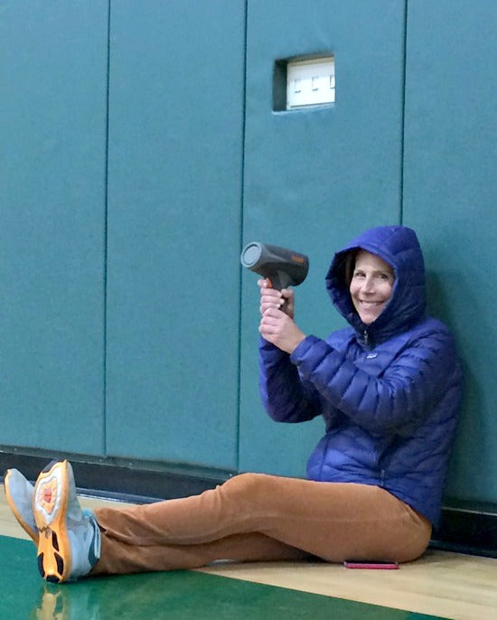 Inventor and owner Laura Gump holding radar speed gun