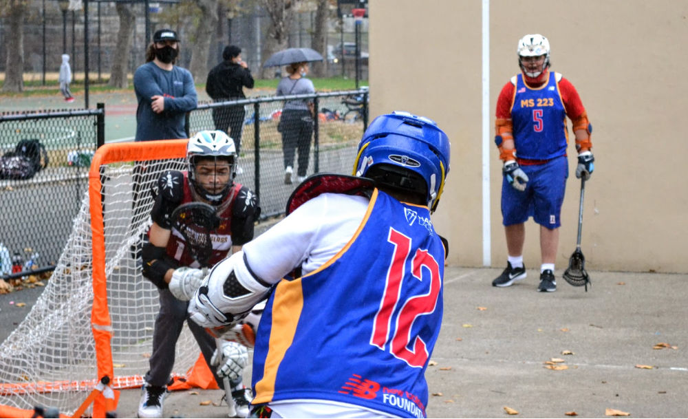 Boys from Harlem Lacrosse practicing lacrosse drills