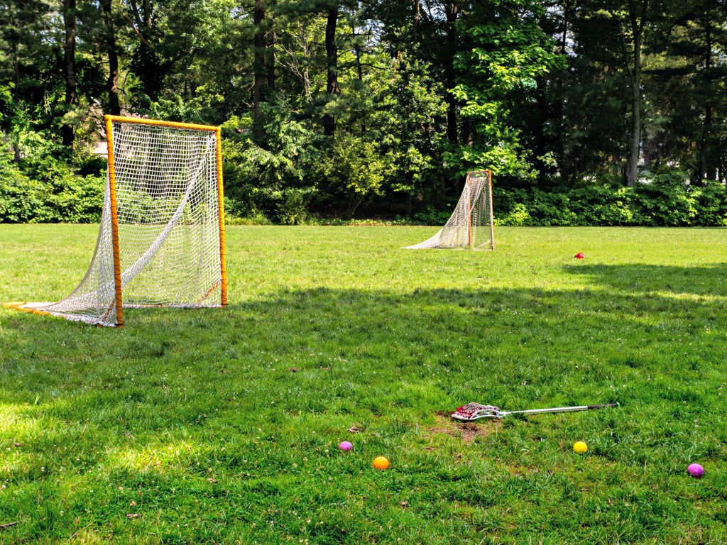 Lacrosse field with Swax Lax lacrosse training balls and stick