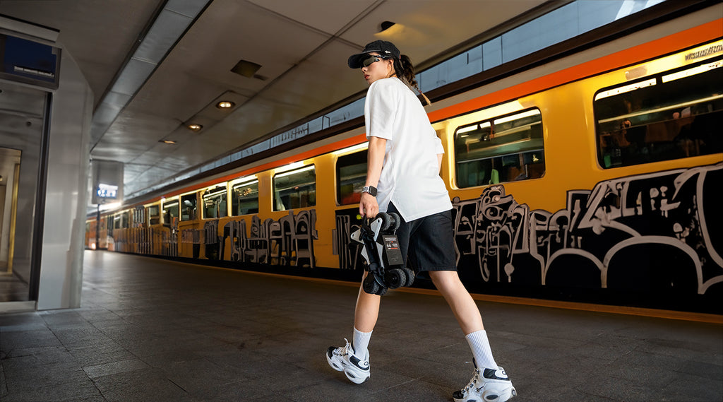 Carrying Rollwalk eRW3 motorized roller skates at the high speed train station-1