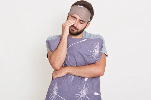 A man with a blindfold covering his eyes