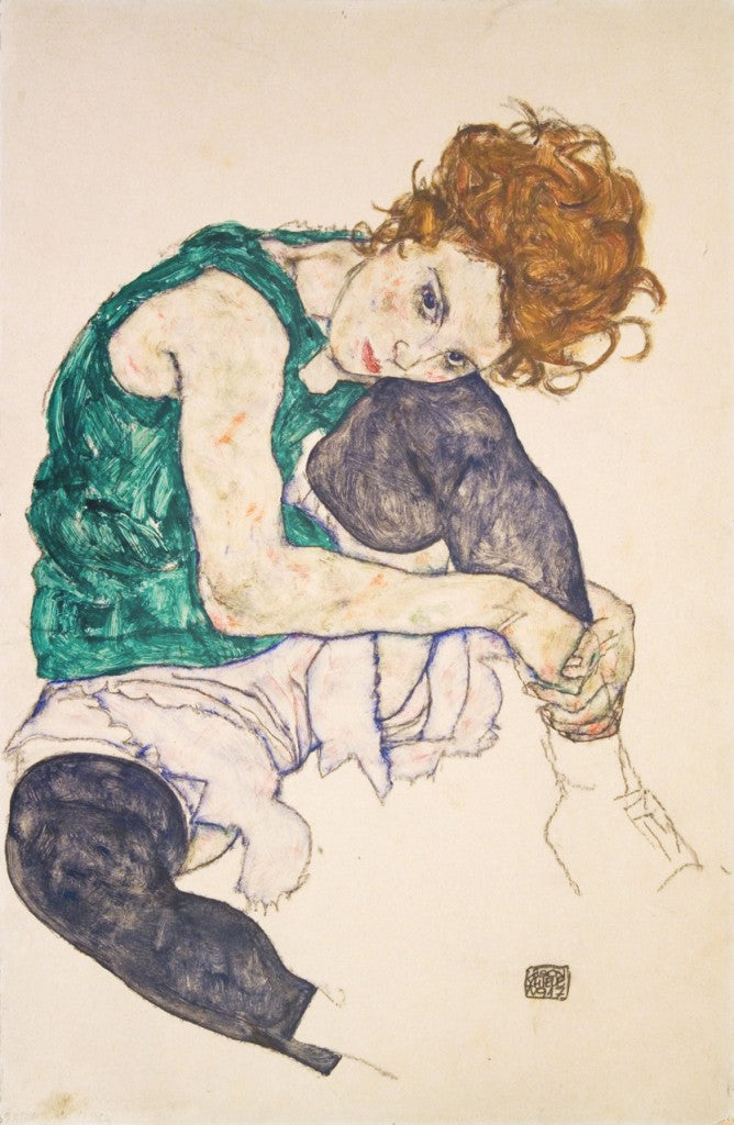 Woman Sitting With Legs Drawn Up