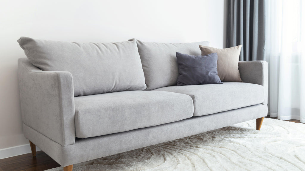 light grey sofa cream cushion
