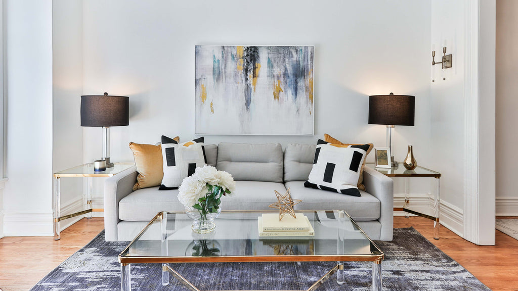 light grey sofa with gold cushions