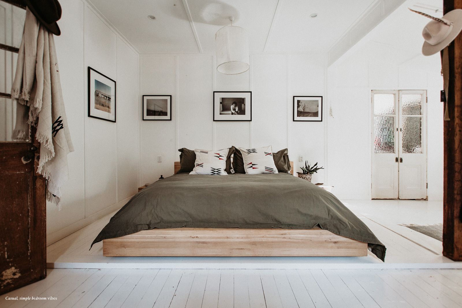 Simple white and khaki bedroom. Claire Tregoning at home