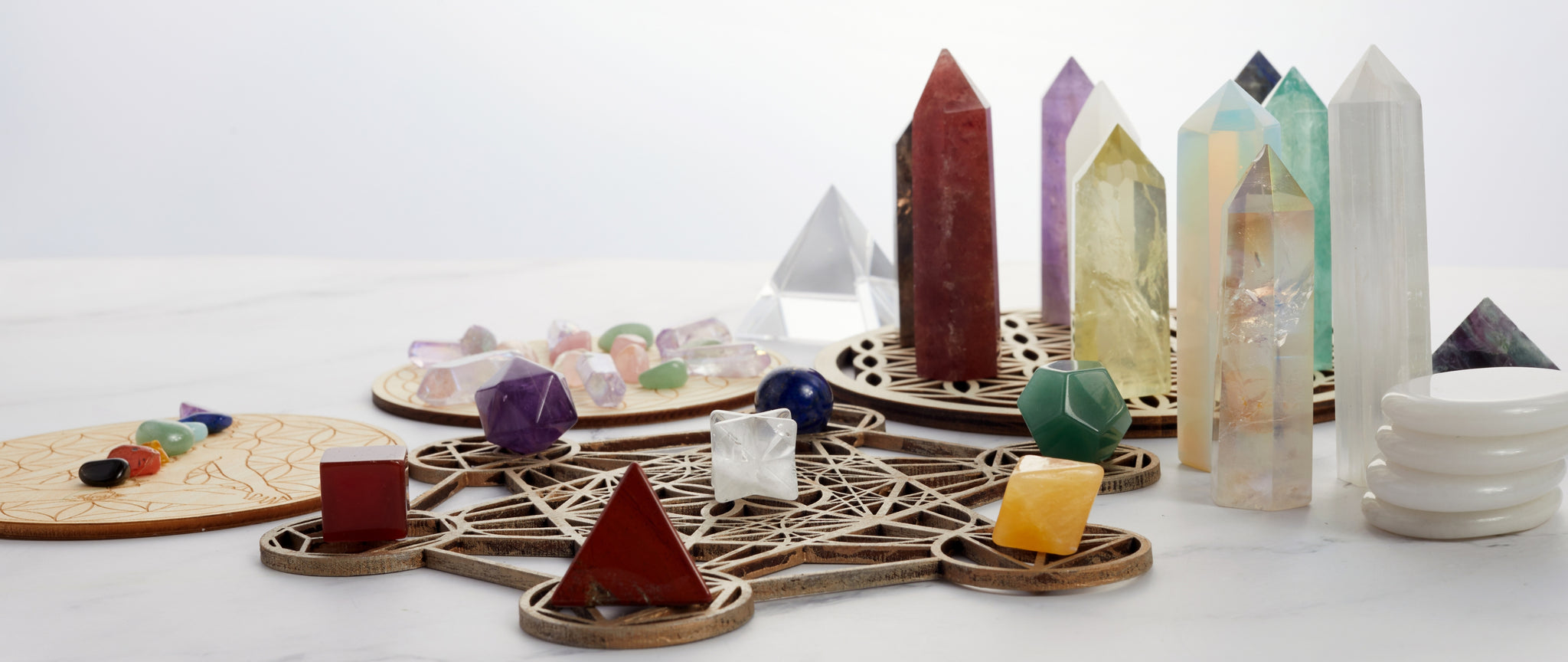 Collection of crystal towers, chakra crystals, and crystal grids