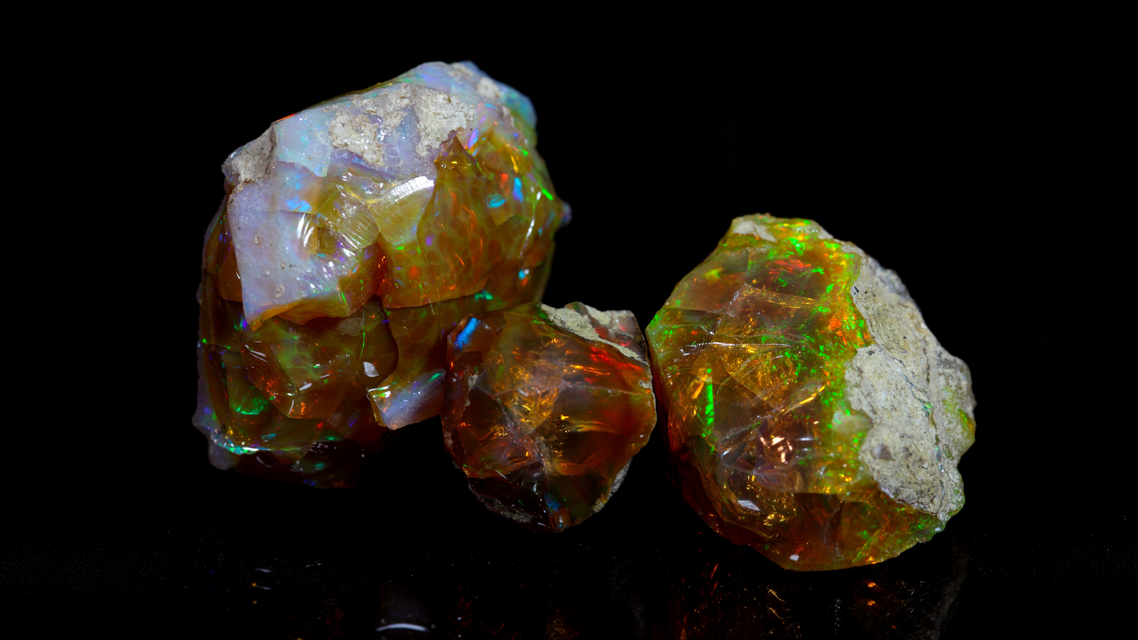 What gives gemstones their colour