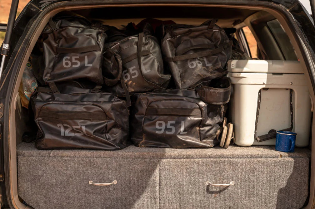 duffels in back of car