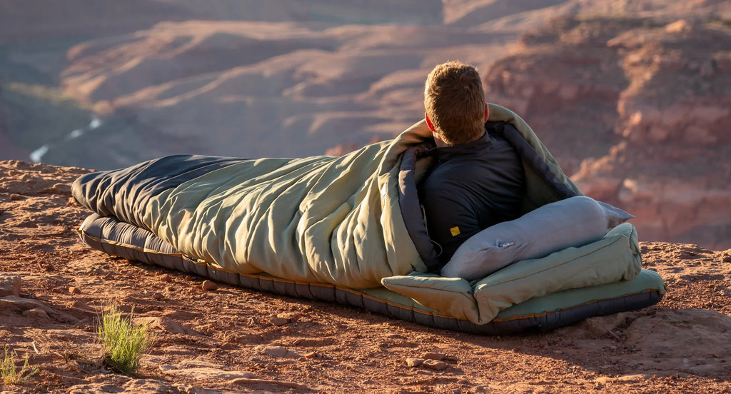 person laying in sleeping bag