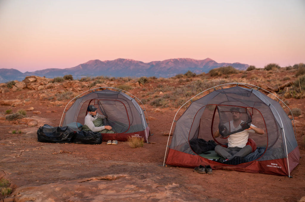 two tents with people in them