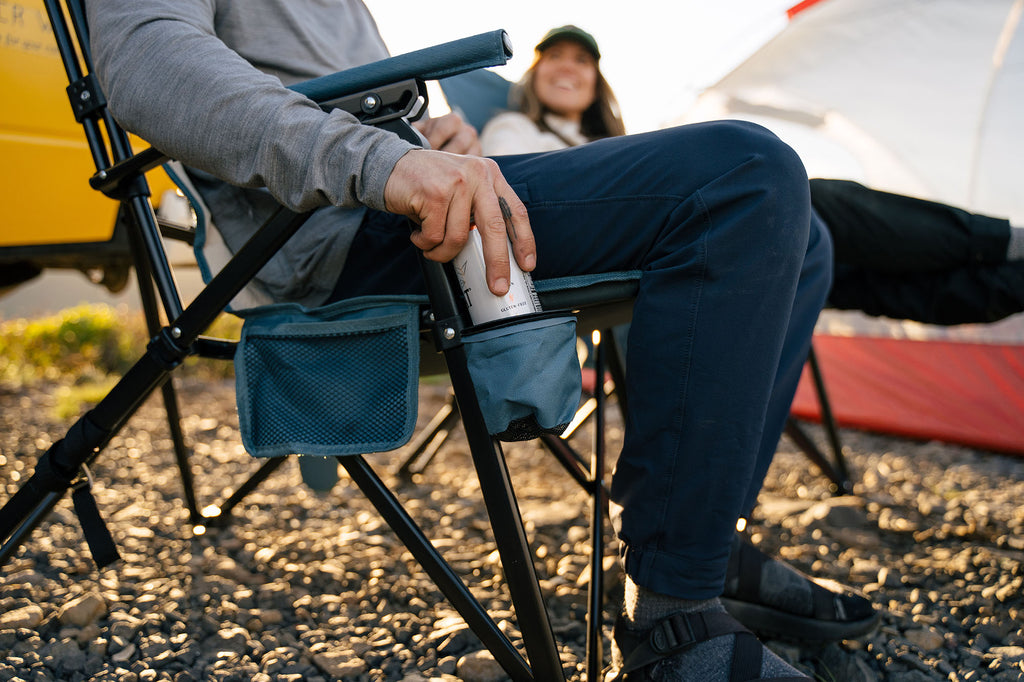person sitting in camping chair