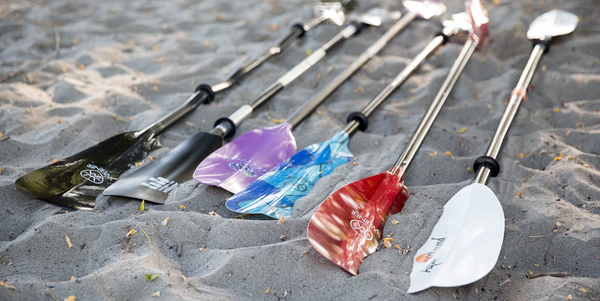 Kayak paddles of varying materials