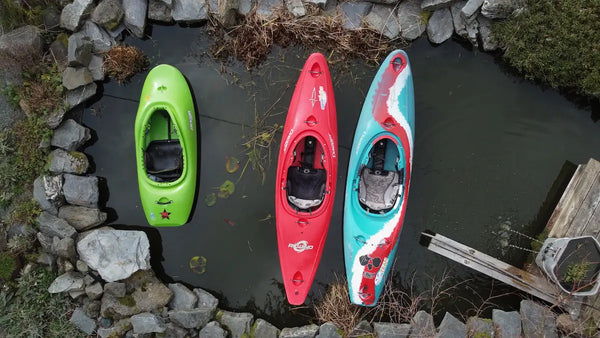 different sized whitewater kayaks