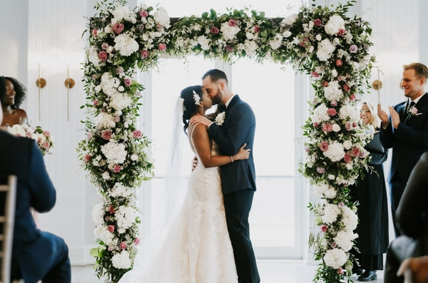 A beautiful spring wedding bouquet with garden roses, sweet peas andlily of the valley.