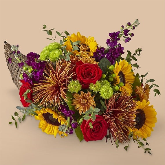 Thanksgiving flower arrangement example with sunflowers, mums, roses, more.