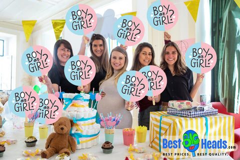 Alt text: "Group of women at a baby shower holding custom ‘Boy or Girl’ big head cutouts from Best Big Heads™."