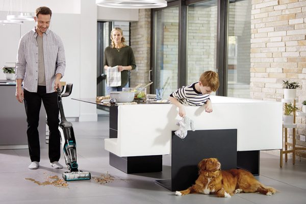 Blog Bissell CrossWave Family with dog, dad cleaning a spill on the floor