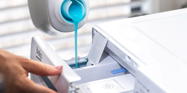 image showing laundry detergent being poured into a Beko AutoDose detergent reservoir