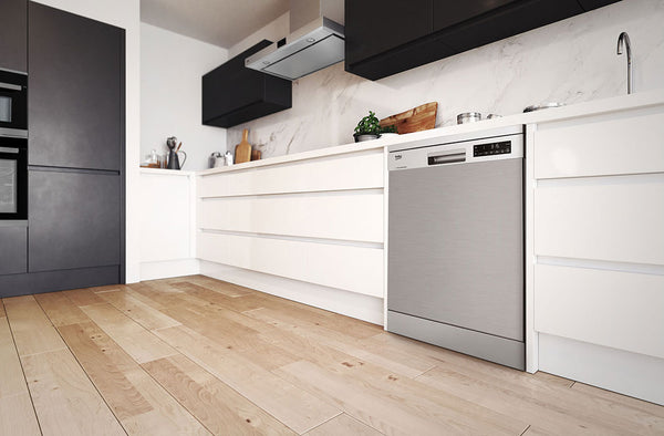 a Beko dishwasher installed in a light coloured kitchen side angle view