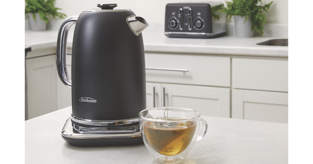 sunbeam alinea black 1.7L kettle with a cup of tea on a benchtop