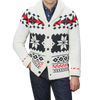 A person is wearing an MC2 Saint Barth Cream White Wool Nordic Aztec Cardigan with a shawl collar, showcasing a black and red geometric pattern against a cream base, elegantly layered over a blue shirt and dark jeans.