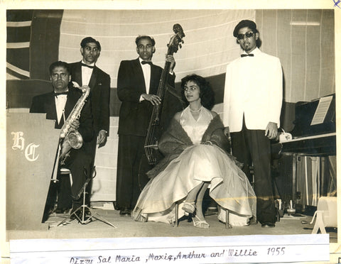 Dizzy Sal performing on stage with band
