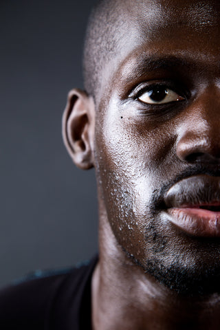 Athletic Black Man having an oily face