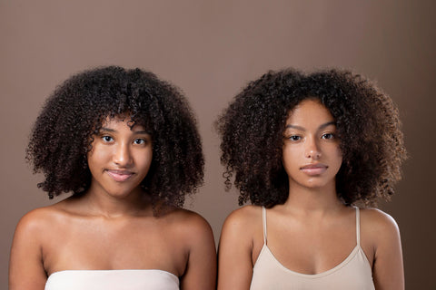 Two beautiful melanin skin ladies standing next to each other