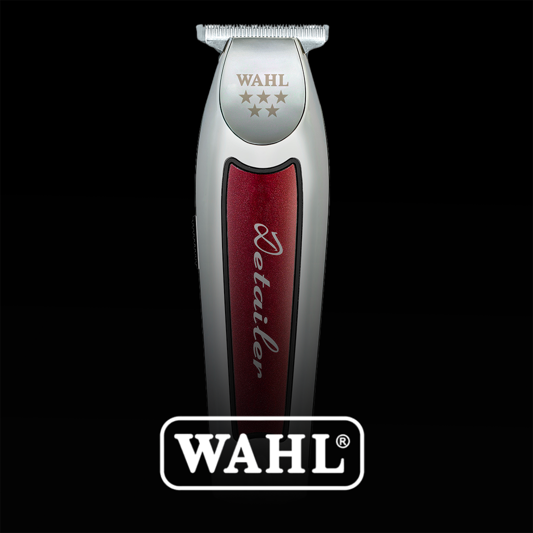 A silver and red Wahl Detailer hair trimmer against a black background.