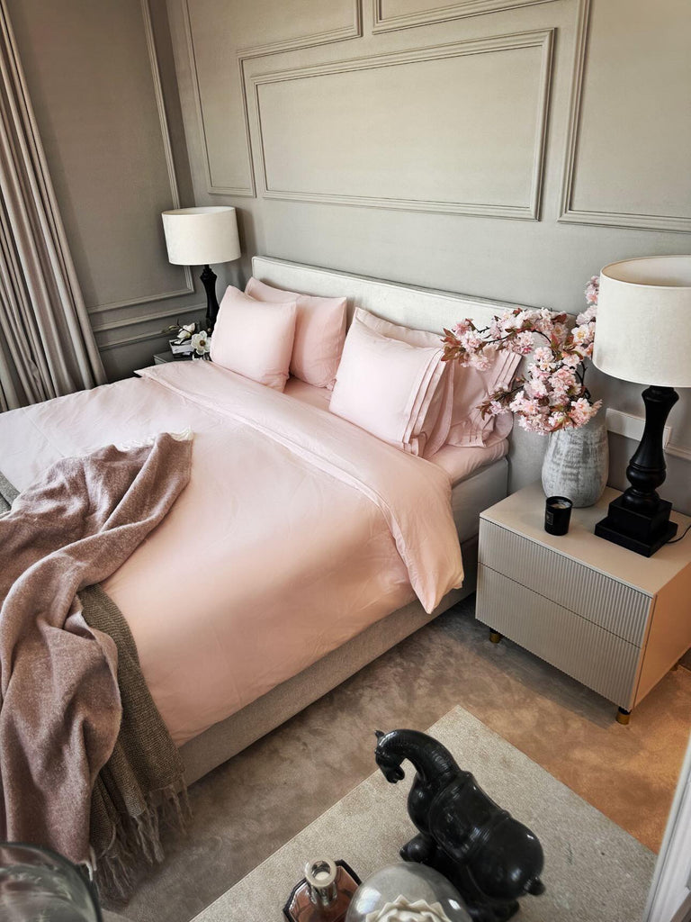 Åsa and Emilios bedding with Gemstone Pink bed linens from Juniper.