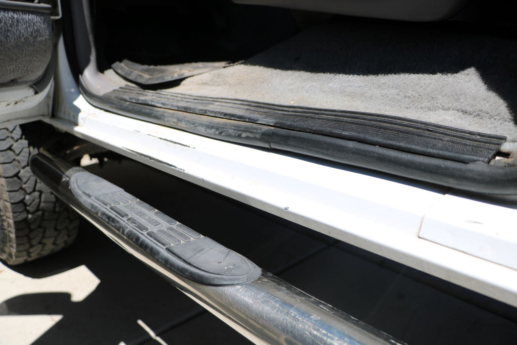 These older Fords used a thin molded plastic trim piece as the sill plate to cover the edge of the carpets and body. Obviously, over time that plastic wears out, scratches, and in this case even warps. It looks terrible and barely serves its purpose anymore.