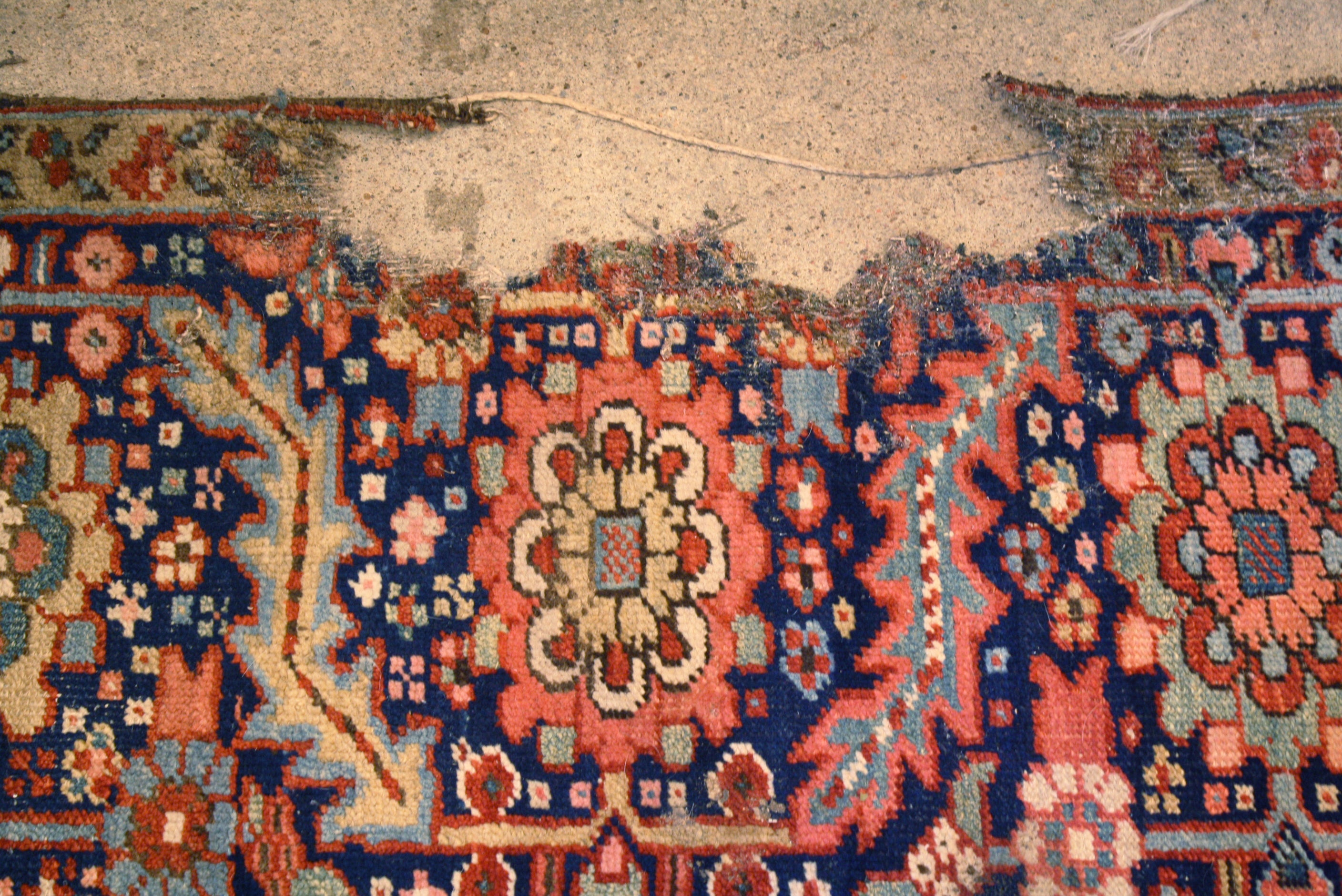 Repair for antique Persian Heriz rug