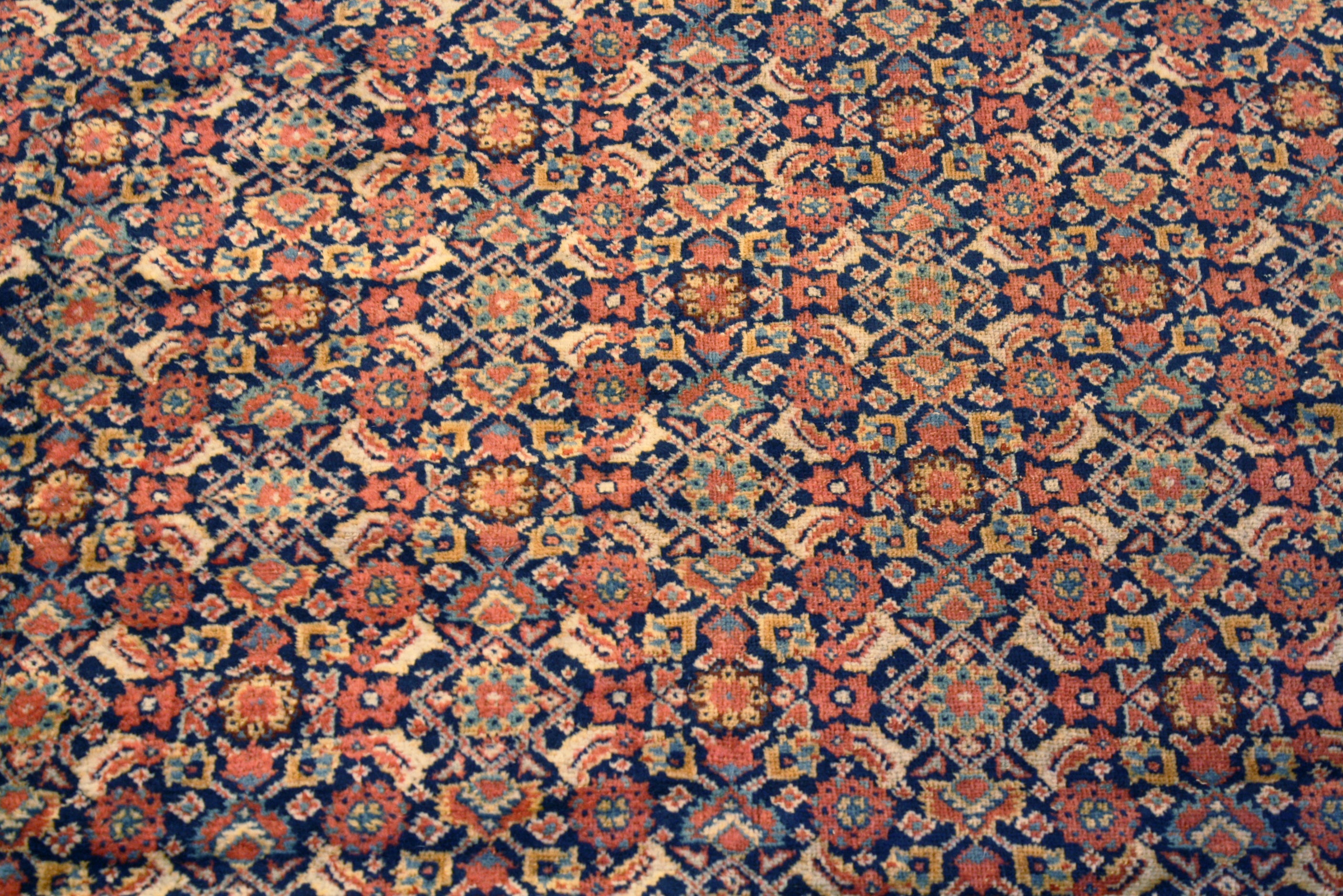 Reweaved antique Persian rug restoration