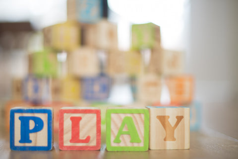 toy blocks spelling out play