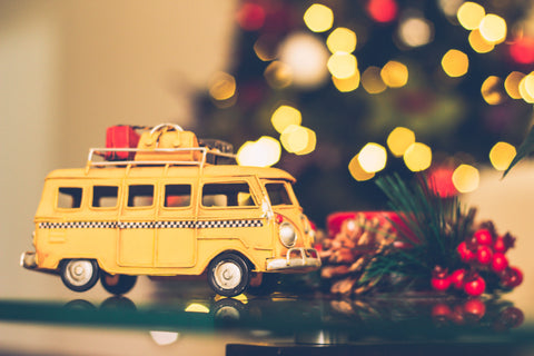 toy bus with Christmas lights in background