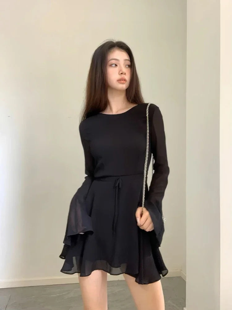 Elegant Backless Black Mini Dress with Lace-Up Detailing - Image 7