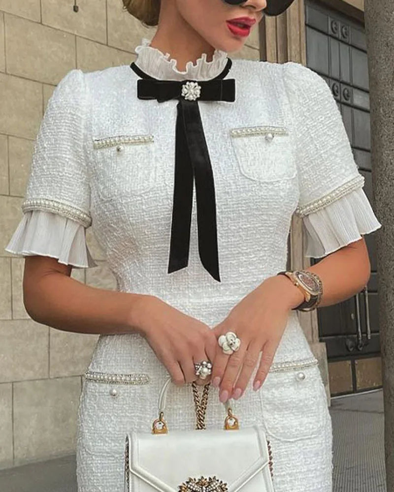 Elegant White Dress with Bow and Ruffle Hem - Image 4