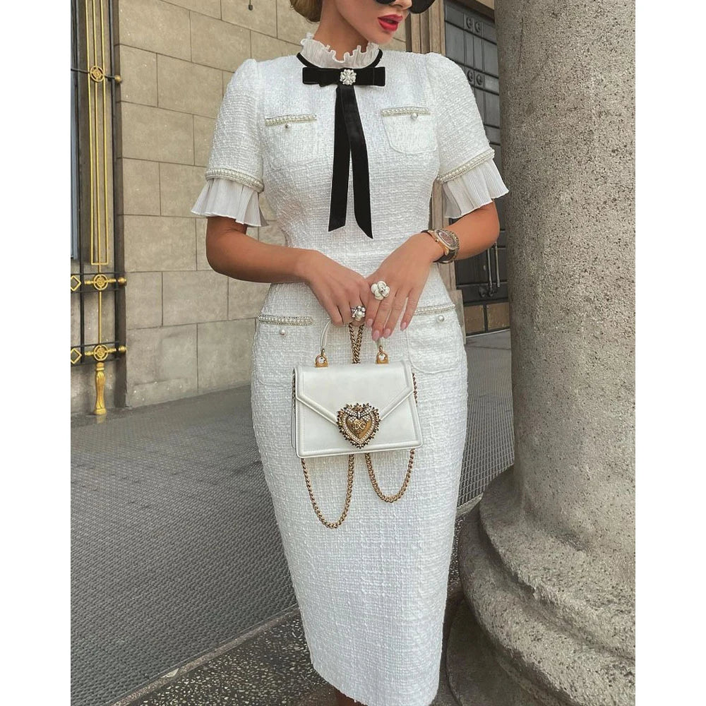 Elegant White Dress with Bow and Ruffle Hem - Image 2