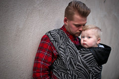 Yaro woven wrap sling for babywearing. A father carrying his baby.
