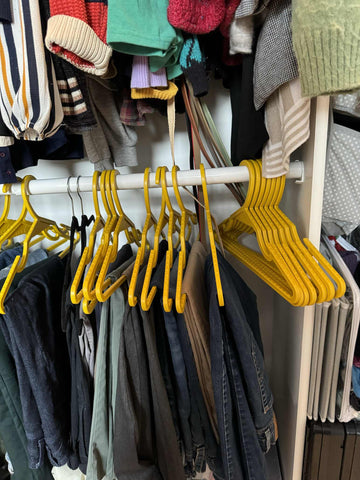 From the REX team, we follow our own advice for hanger storage. Keep your extra hangers that are often in use or have use potential stacked at one end of the closet rod