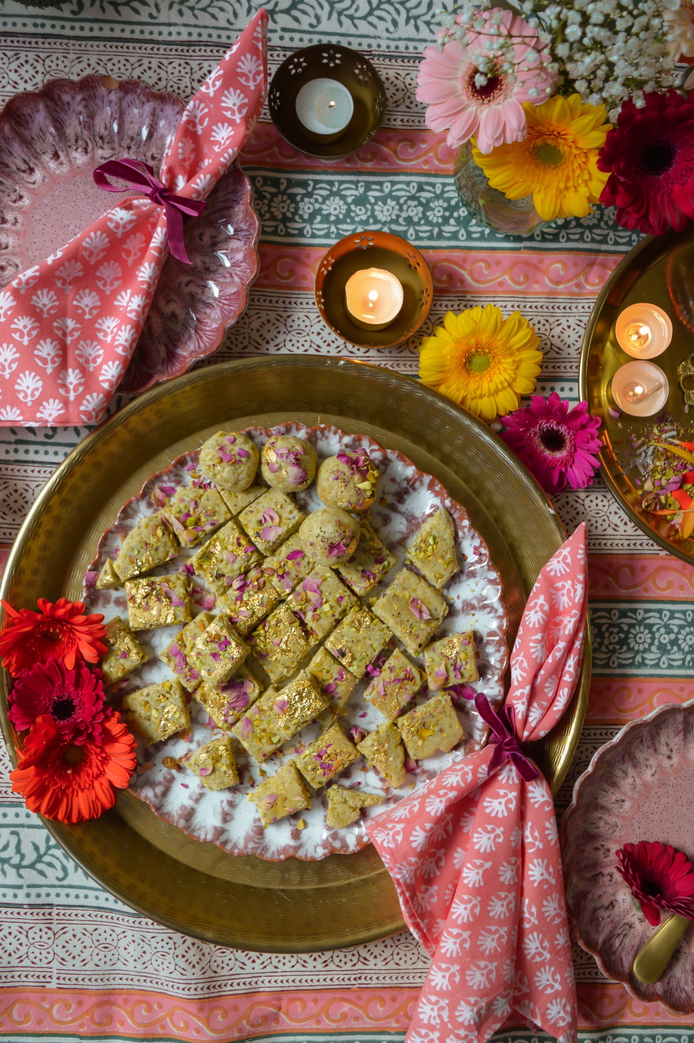 indian diwali desserts table candles flowers