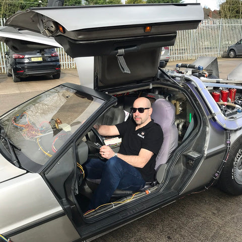 Fanattik boss, Anthony Marks enjoying a go in a Back to the Future Delorean