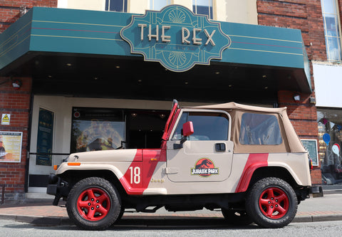 Jurassic Park jeep parked in front of The Rex cinema