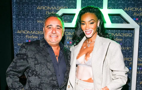 Supermodel Winnie Harlow and Aroma360 CEO Benzion Aboud posing for a picture at Aroma360's perfume and body collection launch.