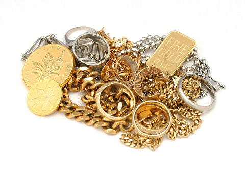 a pile of gold and silver jewelry